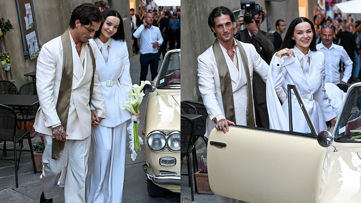 Dove Cameron Breaks Bridal Rules, Marries Damiano David In Chic Cape-Shoulder White Wedding Suit