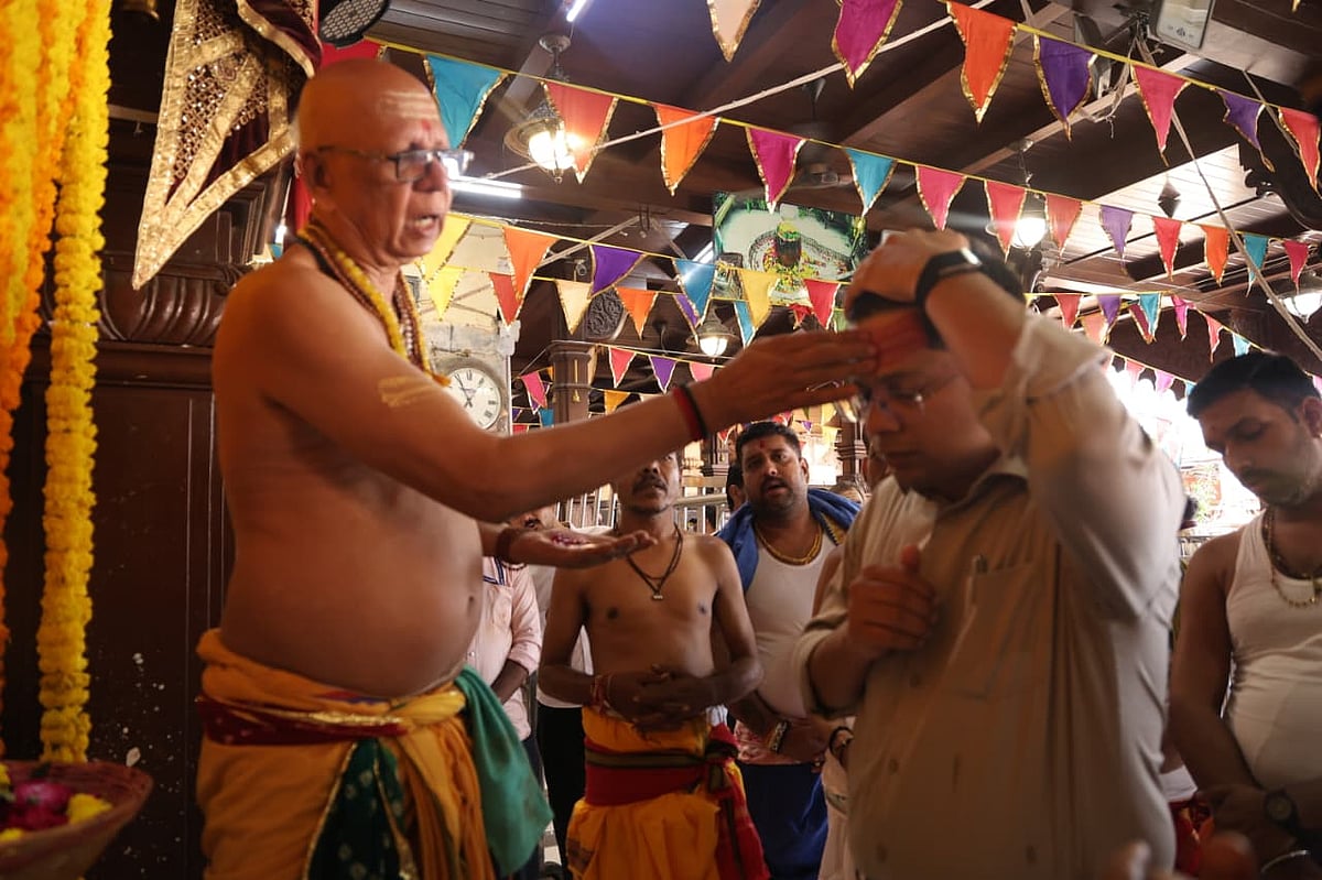 Priest performing ritual during the worship on first day of the mahotsav
