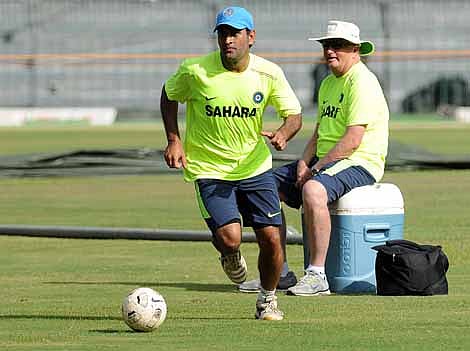 Indian captain Mahendra Singh Dhoni plays football as coach Duncan Fletcher looks on during an ICC T20 Cricket World Cup practice session at the R. Premadasa International Cricket Stadium in Colombo on Monday.