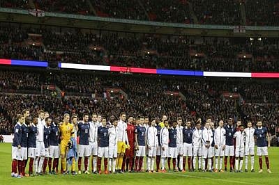 Wembley honours Paris victims with French anthem