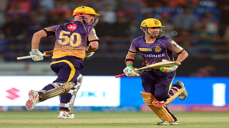 Kolkata Knight Riders cricketers Gautam Gambhir (R) and Chris Lynn run between the wickets during the 2017 Indian Premier League (IPL) Twenty20 cricket match between Gujarat Lions and Kolkata Knight Riders at the Saurashtra Cricket Association Stadium in Rajkot on April 7, 2017. —-IMAGE RESTRICTED TO EDITORIAL USE – STRICTLY NO COMMERCIAL USE—– GETTYOUT / AFP PHOTO / PUNIT PARANJPE / —-IMAGE RESTRICTED TO EDITORIAL USE – STRICTLY NO COMMERCIAL USE—– / GETTYOUT