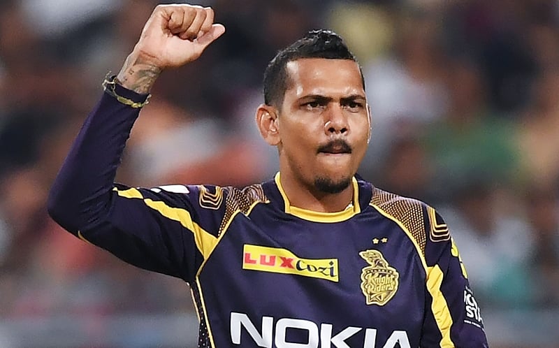 Sunil Narine celebrates after taking the wicket during the 2018 IPL match . / AFP PHOTO / Dibyangshu SARKAR / -GETTYOUT