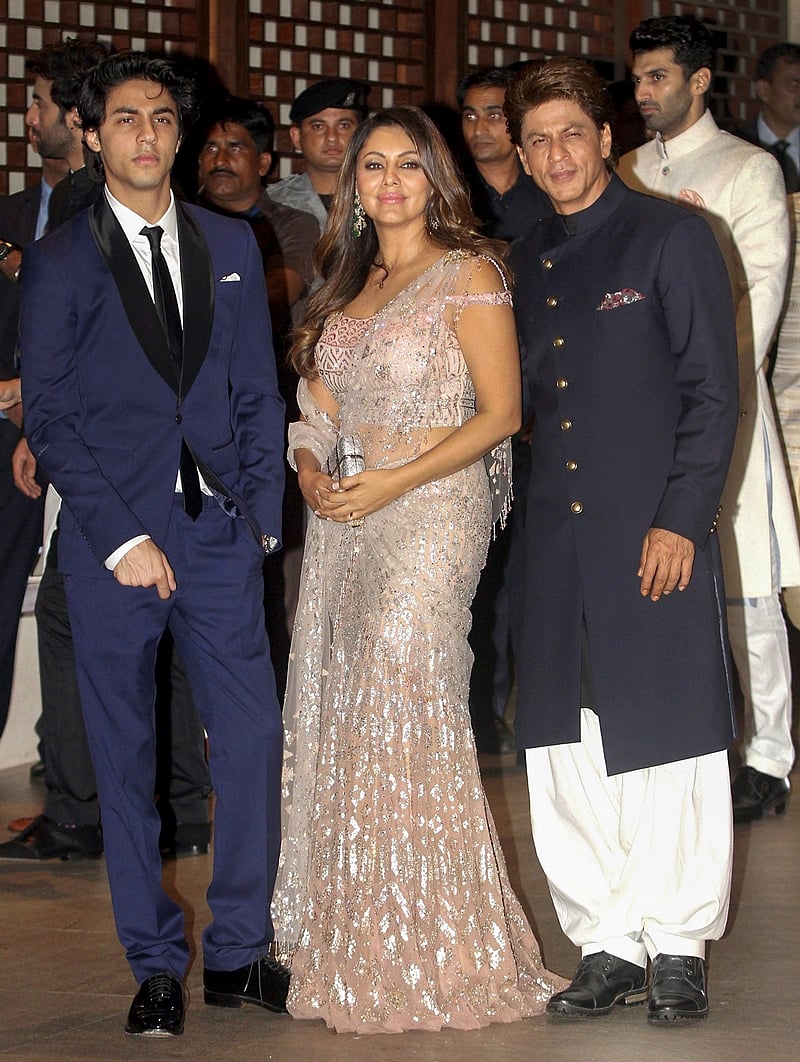 Mumbai: Bollywood actor Shah Rukh Khan with wife Gauri Khan and son Aryan Khan pose for a photo at the pre-engagement party of Akash Ambani and fiancee Shloka Mehta, in Mumbai on Saturday, June 30, 2018. (PTI Photo) (PTI7_1_2018_000078B)