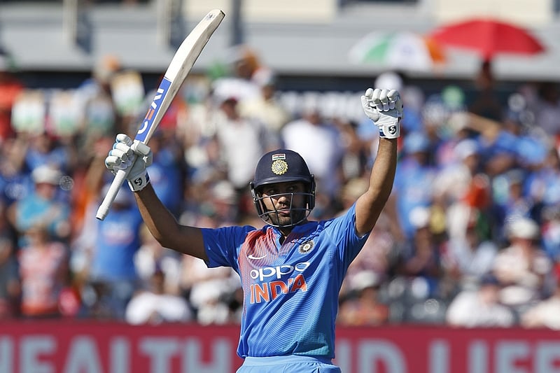India’s Rohit Sharma celebrates after reaching his century during the third international Twenty20 cricket match between England and India at The Brightside Ground, Bristol on July 8, 2018. / AFP PHOTO / Ian KINGTON / RESTRICTED TO EDITORIAL USE. NO ASSOCIATION WITH DIRECT COMPETITOR OF SPONSOR, PARTNER, OR SUPPLIER OF THE ECB