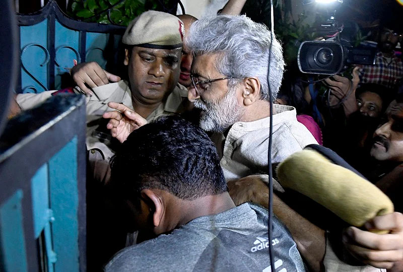 Human rights activist Gautam Navlakha at his residence after he was arrested by the Pune police.  | PTI Photo