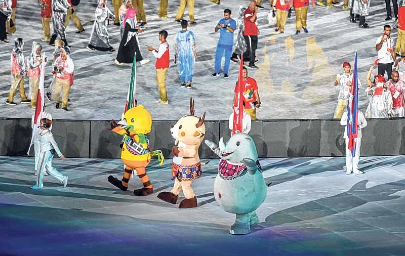 <em><strong>Official Games’ mascots Bhin Bhin, Ika and Atung march during the closing ceremony in Jakarta on Sunday</strong></em>