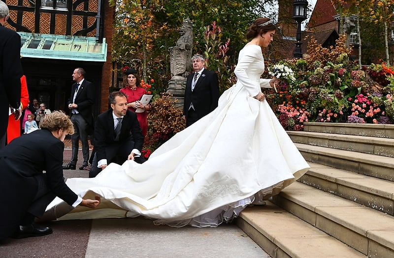 Britain’s Princess Eugenie of York (R) arrives for her wedding to Jack Brooksbank at St George’s Chapel, Windsor Castle. Photo by Victoria Jones / POOL / AFP