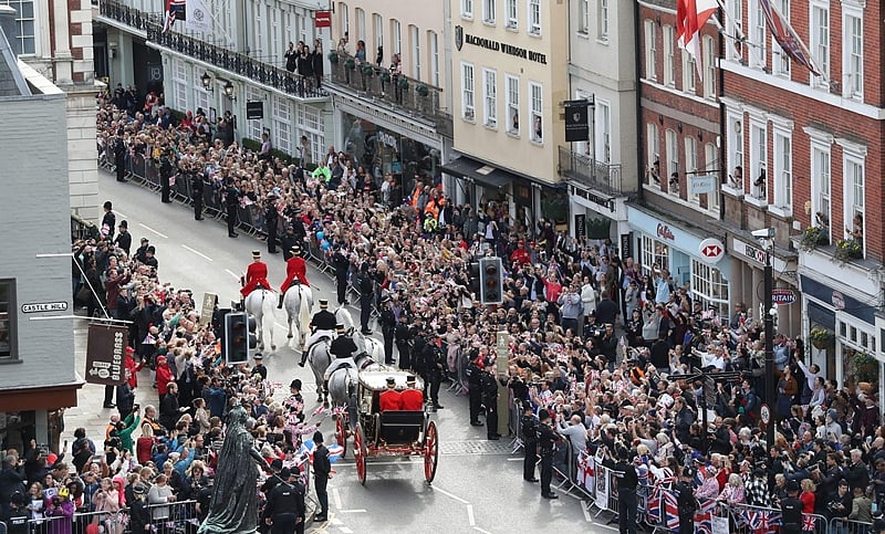 Britain’s Princess Eugenie of York and her husband Jack Brooksbank travel in the Scottish State Coach at the start of their carriage procession following their wedding at St George’s Chapel, Windsor Castle in Windsor, on October 12, 2018. (Photo by Andrew Matthews / POOL / AFP)