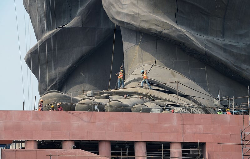 Indian workers give the finishing touches to the world’s tallest statue dedicated to Indian independence leader Sardar Vallabhbhai Patel. Photo by SAM PANTHAKY / AFP