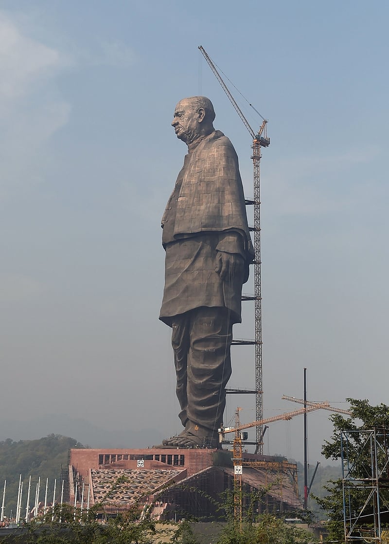 Indian workers give the finishing touches to the world’s tallest statue dedicated to Indian independence leader Sardar Vallabhbhai Patel, overlooking the Sardar Sarovar Dam near Vadodara in India’s western Gujarat state. Photo by SAM PANTHAKY / AFP