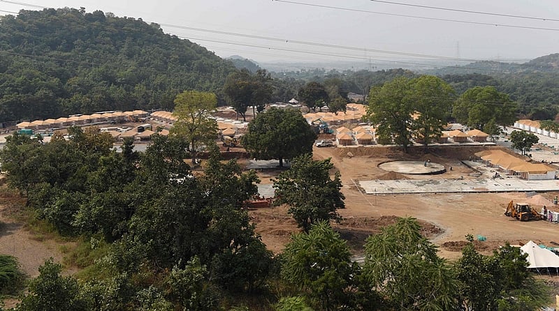 Indian workers work on an accommodation area with tents for visitors to the world’s tallest statue dedicated to Indian independence leader Sardar Vallabhbhai Patel. Photo by SAM PANTHAKY / AFP
