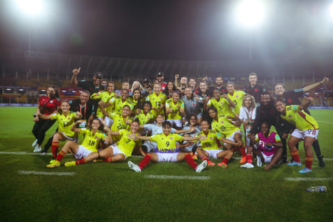 The Colombian girls exult after the win.   