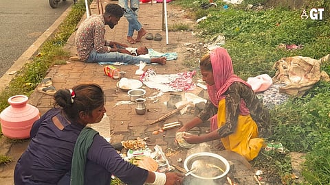 Family living and cooking on the pavement in Goa.