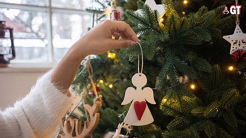 Decorating a Christmas tree.