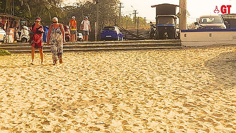 Tourists head for the beach in Goa early in the morning.