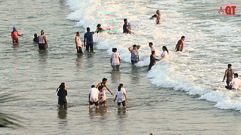 Tourists enjoy on a Goa beach.