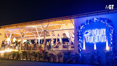 Enjoy the views and drinks at Blue Turtle in Morjim.