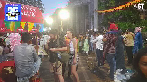 Tourists reach for ice cream in order to survive the hot weather during the Carnival celebrations.