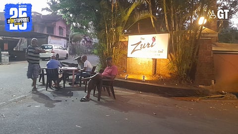 Taxi drivers outside a resort.