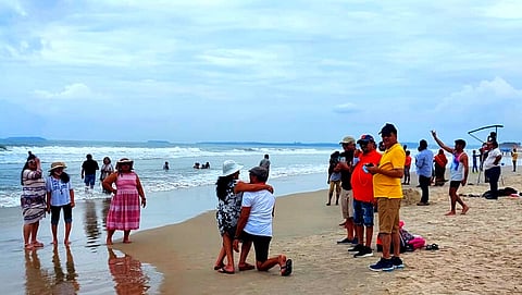 Tourists take selfie at Colva Beach on Sunday, September 27, 2021