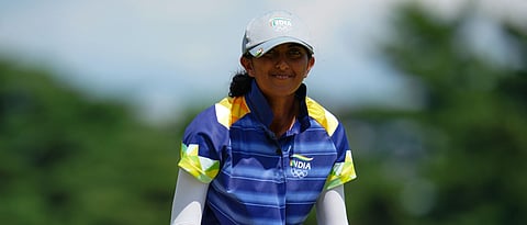 India's Aditi Ashok (L) watches her drive from the 11th tee in round 4 of the womens golf individual stroke play during the Tokyo 2020 Olympic Games at the Kasumigaseki Country Club in Kawagoe on August 7, 2021.