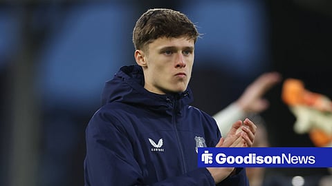 Harrison Armstrong applauds Everton fans following a game