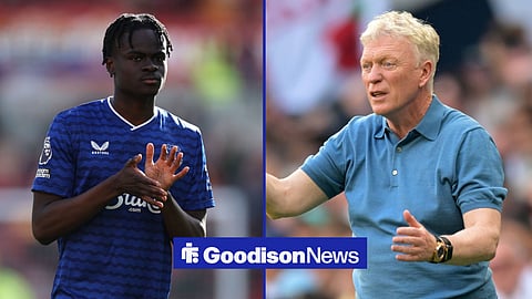 Tyrique George in action for Everton on the left with David Moyes on the touchline on the left