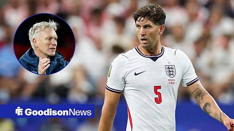 Everton manager David Moyes looking in the direction of England international John Stones, who is playing at the World Cup against Croatia.