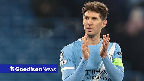 John Stones applauding whilst in action for Manchester City