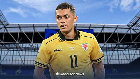Everton's Brennan Johnson wearing a Wales shirt with Hill Dickinson Stadium in the background