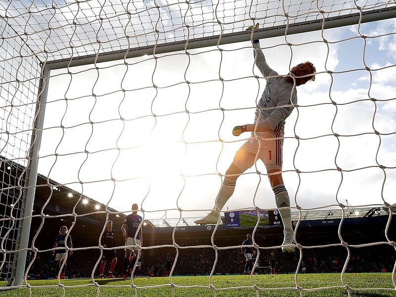 Leicester City's Danish goalkeeper Kasper Schmeichel tips the ball over the bar during the English Premier League football match against Chelsea