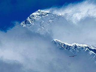 Above: Clouds surrounding the Himalayan mountain Mount Everest from Syangboche in the Everest region, some 140 kms northeast of Kathmandu.
