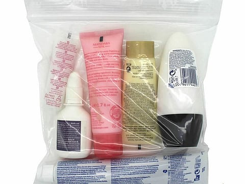 Passengers pass through upgraded security scanners at Heathrow Airport, where the 100ml liquid limit for hand luggage has now been scrapped on departing flights, following the rollout of new CT screening technology. 