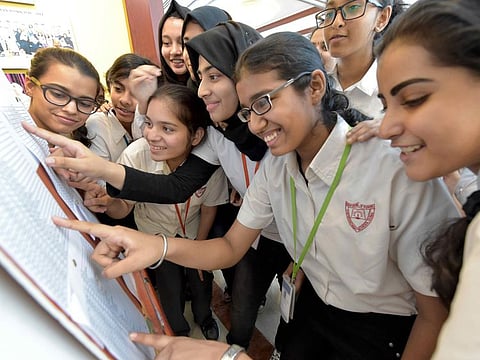 Students of  The Indian High School, Oud Metha road, Dubai are searching for their class 10th CBSE result  in the school permises
