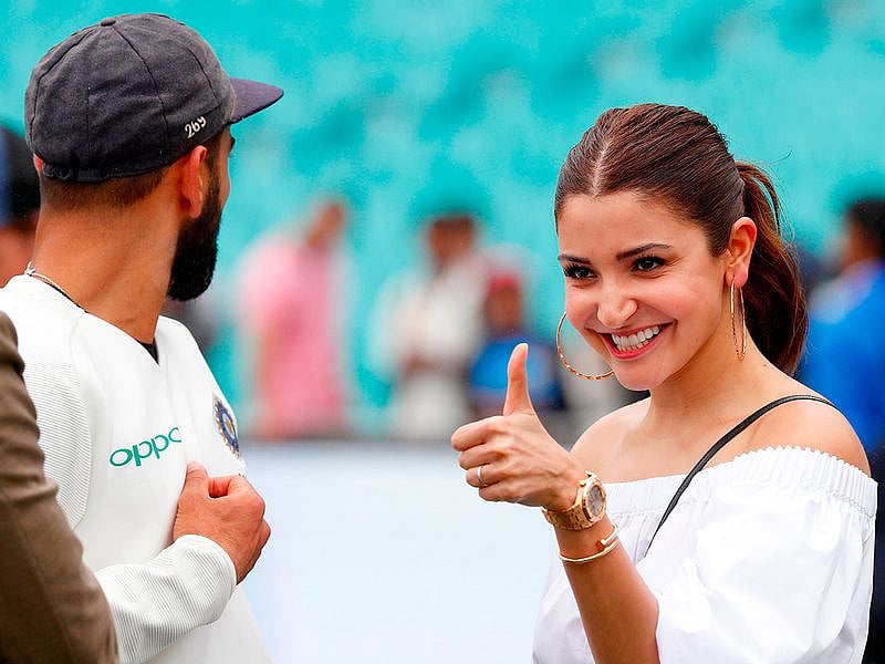 Virat Kohli looks at his wife Anushka Sharma