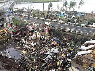Destroyed houses caused by Super Typhoon Rai (locally codenamed Odette) after the storm crossed over Surigao City in Surigao del Norte province.