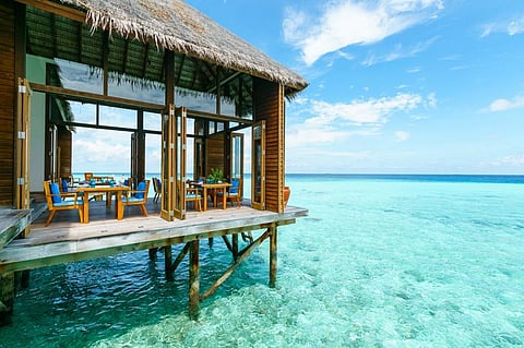Rustic chalets raised over glittering turquoise waters are par for the course in The Maldives.