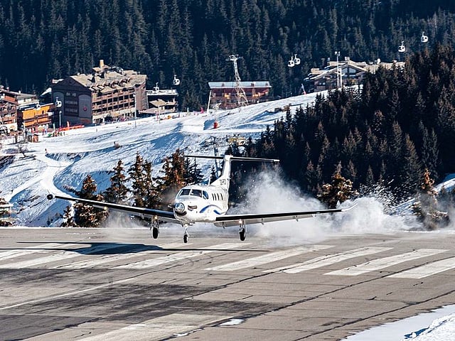 A Pilatus PC12 during a dangerous landing where it has touched down before the runway at Courchevel Airport, France. Serving the ski resort in the French Alps, Courchevel Airport has a 1,762-ft-long runway and is mainly used by helicopters, as well as small fixed-wing aircraft. The runway is on a mountain at an elevation of 2,008m.
