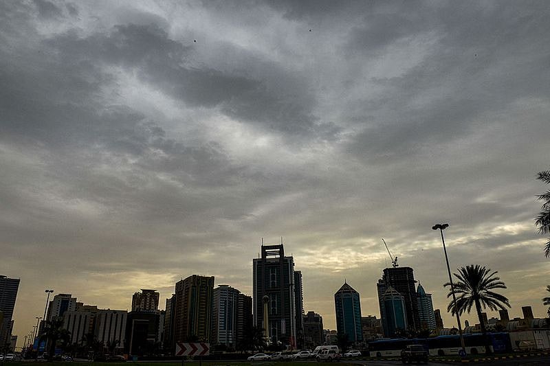 Residents enjoying light drizzle at Buheirah Corniche in Sharjah on Thursday morning. 