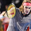 Stefanos Tsitsipas of Greece hits a return during his men's singles second round match against Australia's Alex de Minaur at the Japan Open tennis championships in Tokyo on October 4, 2018.