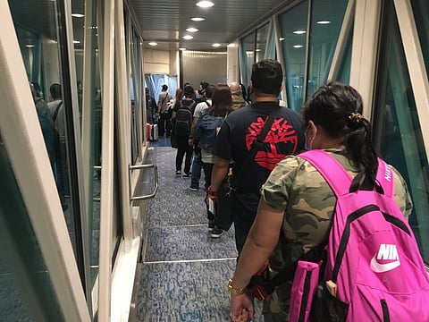 For non-resident citizens (i.e. Overseas Filipino Workers, OFWs) — income is taxable only when derived from sources within the Philippines. The Tax Code (Section 23) provides that an OFW's income from abroad (income from overseas employment) is exempt from income tax. The OFW tax exemptions stay under TRAIN law. But while OFW income from overseas are tax-exempt, income derived in the Philippines (investments, capital gains tax) are not. | File photo of OFWs flying back to the Philippines. 