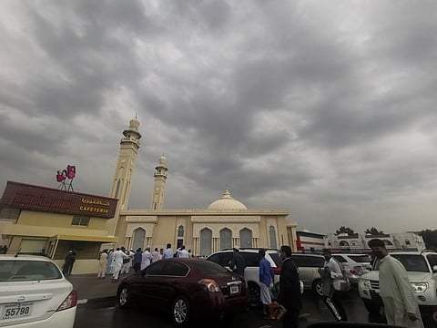 Cloudy skies over a mosque in Sharjah's Maysaloon area.