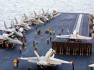 Two US F-18 fighters prepare to take off from a US aircraft carrier. File photo