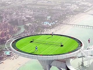 The famous picture of Federer and Andre Agassi, playing tennis on the helipad of Burj Al Arab ahead of the 2005 edition. 