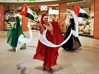 People enjoy the beautiful Flag Dance roaming performance taking place at the Dubai Hills Mall  in celebration of the UAE National Day.