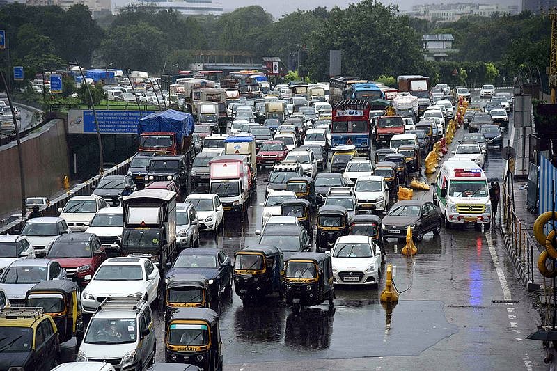 A long vehicular traffic jam seen on Western Express Highway due to heavy rainfall, at Vile Parle East, in Mumbai on Tuesday. (ANI Photo)