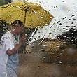  A man walks with umbrella when it rained in Sharjah. For illustrative purposes only.