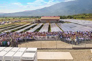 Manila's sovereign wealth fund Maharlika Investment Corp. (MIC) has partnered with Saudi Arabia's ACWA Power to electrify off-grid islands in the Philippines. The initiative targets isolated communities that rely on costly fossil generators, addressing both energy poverty and environmental concerns. Photo shows a community solar power project in Paluan town on the island of Mindoro, the first solar-plus-storage microgrid system in Asia to use Tesla’s Powerpack energy storage system installed in 2018 to end power outages on the island.