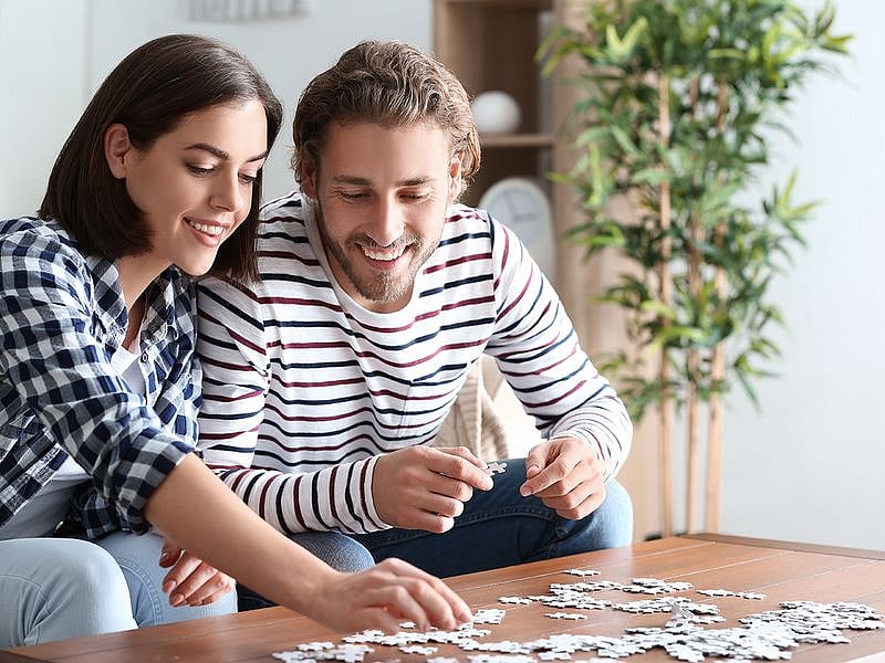 Couple doing puzzles