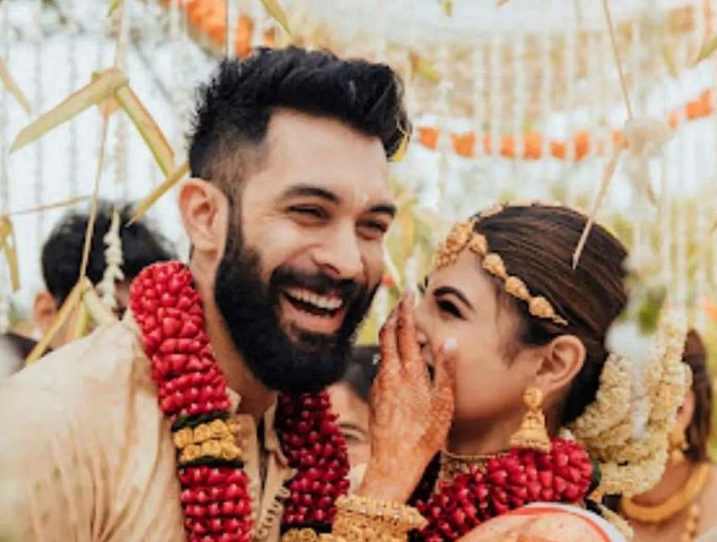 Suraj Nambiar with Mouni Roy on their wedding day